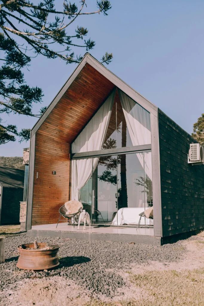 A small cabin with a wood burning stove