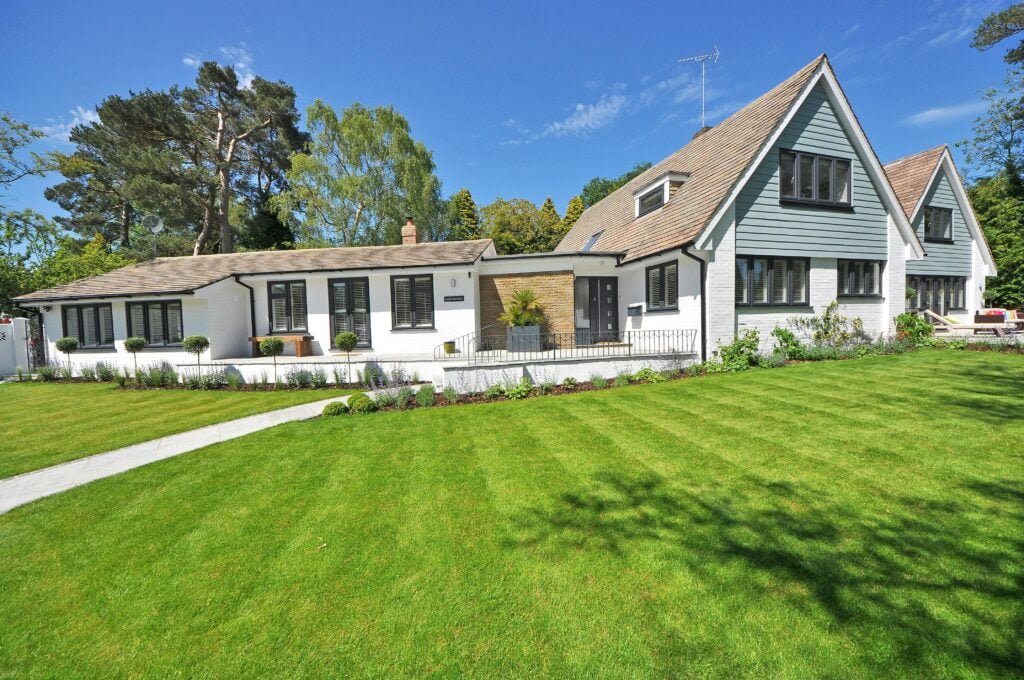 White Wooden 2-storey House Near Tree